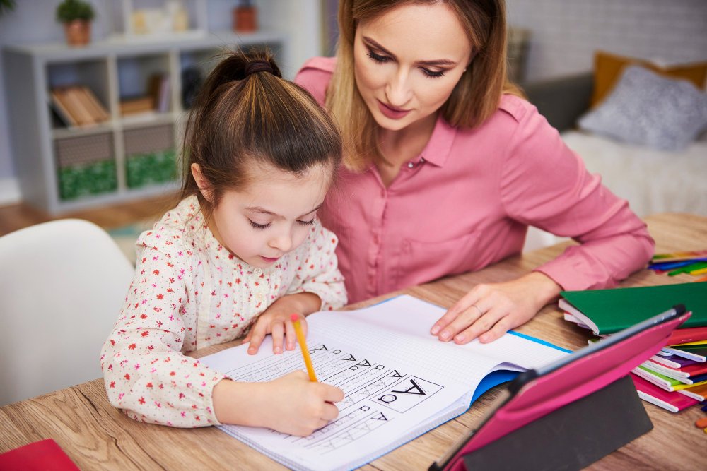 young-woman-helping-girl-with-homework
